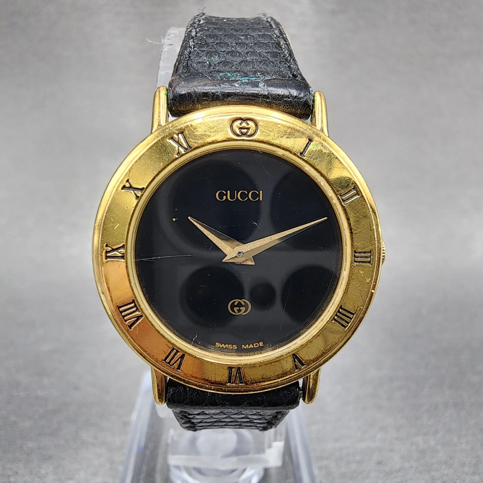 Montre Gucci 3000L femme 26mm cadran noir plaqué or ronde pile neuve très bon état
