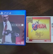 Pair of Hitman 2 and The Legend of Zelda Ocarina of Time