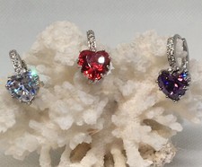Sterling silver hoop earrings with dazzling heart shaped clear CZ. Romance.