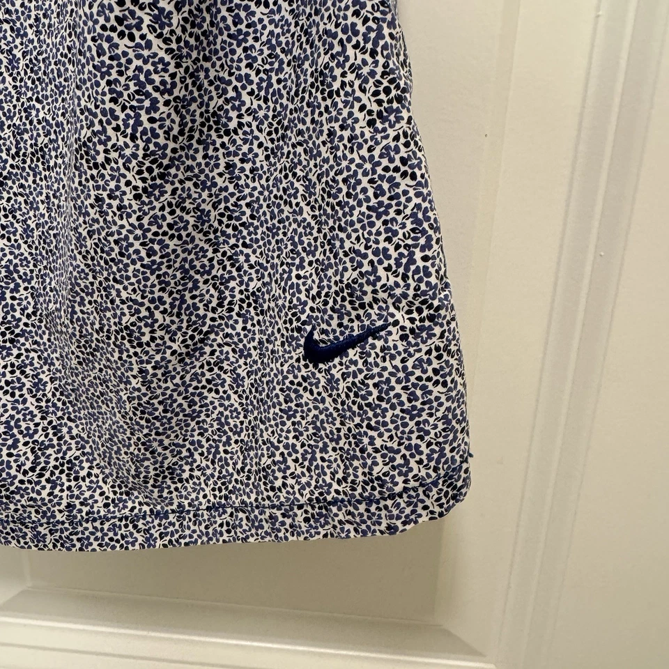 Camisa de golf Nike azul y blanca floral sin mangas con botones talla L Foto 2 de 4