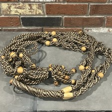 decorative macrame plant hanger featuring braided rope and wooden beads 2 Plants