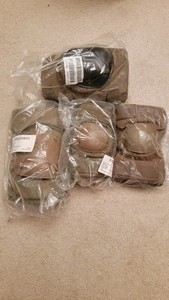 Lot of Military knee and elbow pads various sizes and colors.