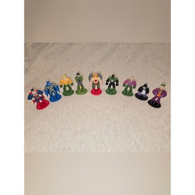 Vintage PVC figures features various DC Comics characters