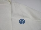 White short-sleeve Sz L Vtg Bermuda cotton T-shirt with blue monogram logo on left chest, small white text “Sz L” on sleeve.