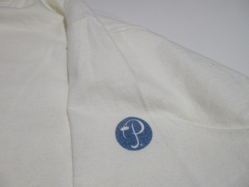 White short-sleeve Sz L Vtg Bermuda cotton T-shirt with blue monogram logo on left chest, small white text “Sz L” on sleeve.
