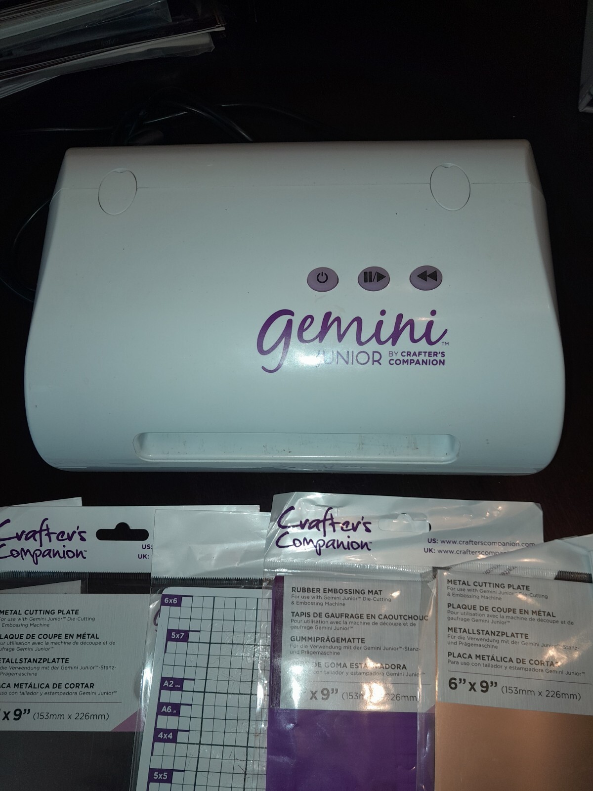 A Gemini Junior die cutting machine, with Cutting Pads And Over 100