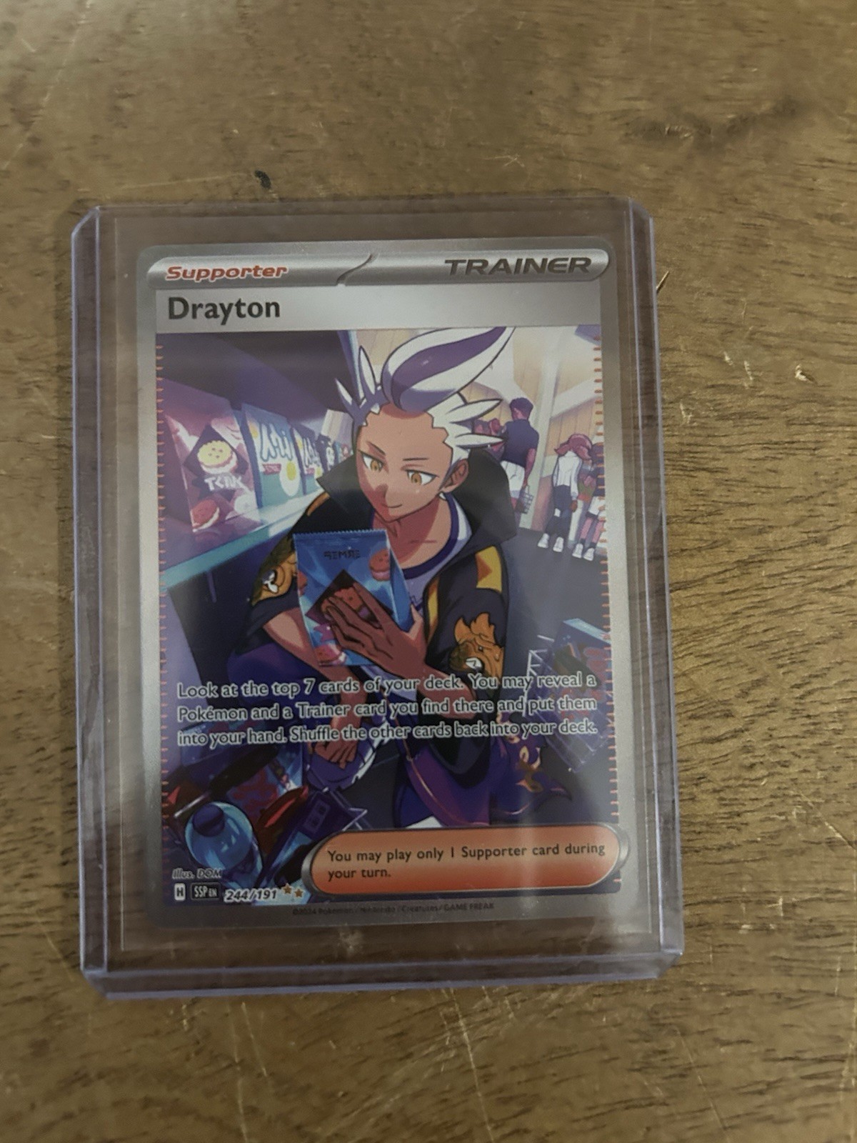 The Pokémon Company Drayton 244/191 Holo SV08 Surging Sparks SIR EN 2024