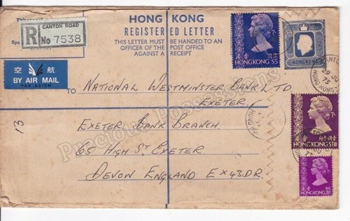 HONG KONG REGISTERED LETTER 1973 PREPAID $1 UPRATED WITH $6.50 STAMPS TO ENGLAND