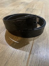 Hand tooled black belt 38