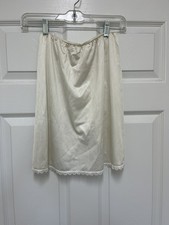 VINTAGE WOMENS IVORY MONTGOMERY WARD - HALF SLIP - SIZE PETITE - BACK SLIT