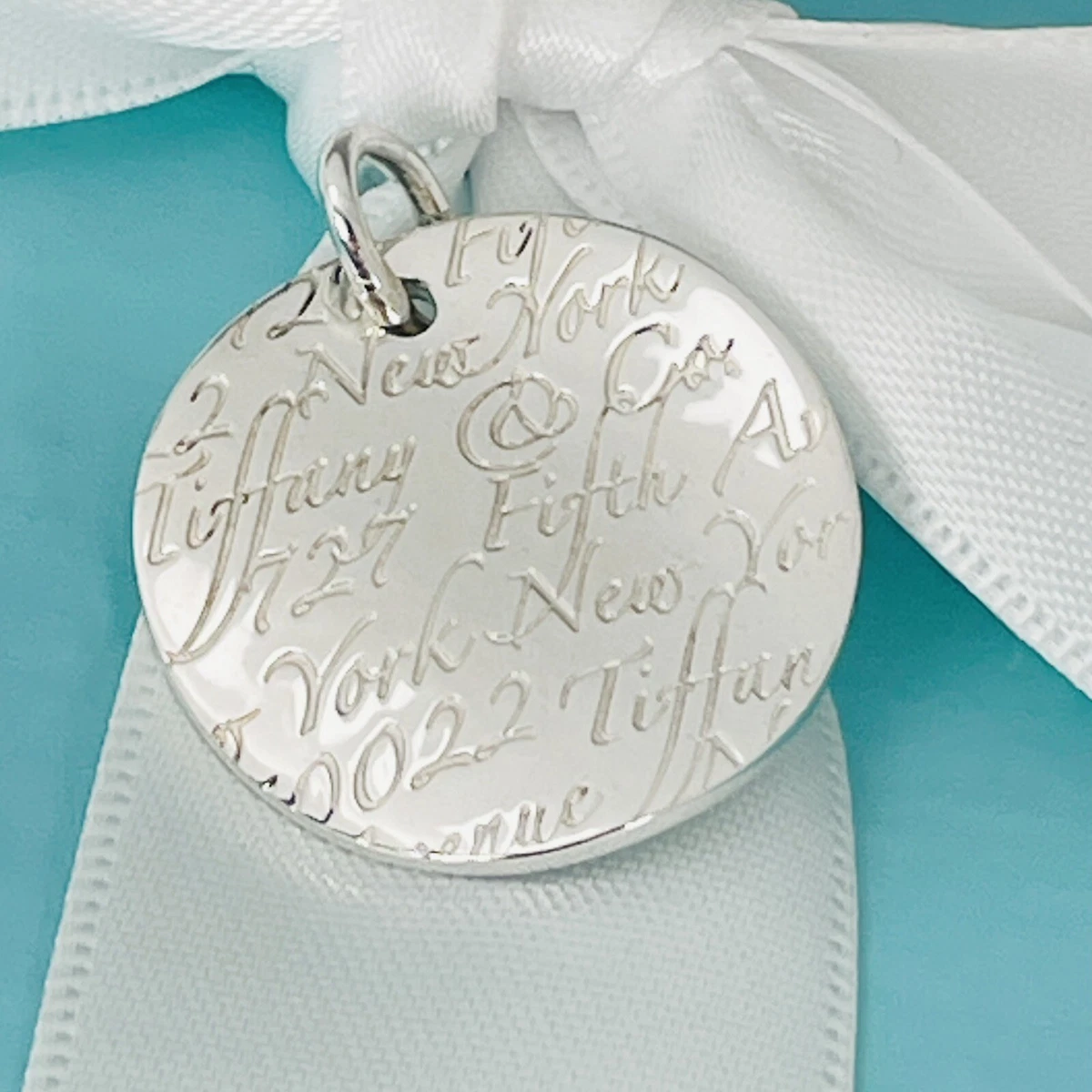 Tiffany & Co Notes 727 Fifth Ave Wave Round Pendant in Sterling
