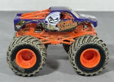 Spin Master Monster Jam Truck Storm Damage Muddy Tires Blue Orange 1:64