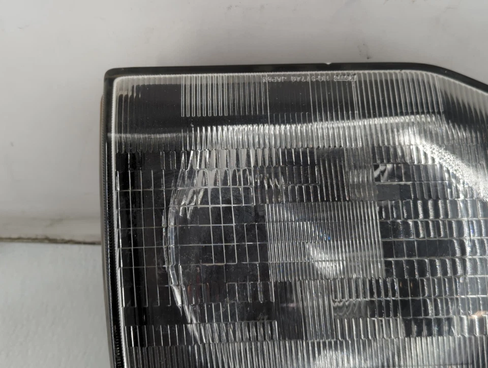 Luz de cabeza izquierda OEM 1992-1997 Mitsubishi Montero GD6I9 Foto 2 de 4