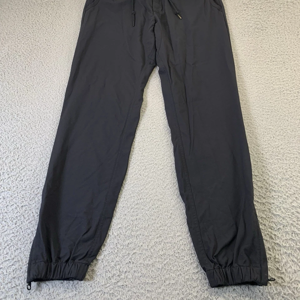 Pantalones Nike Sportswear V442 para hombre medianos negros botones a presión cordón 30" entrepierna Foto 4 de 4