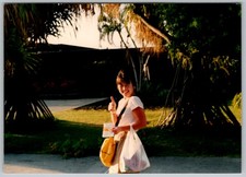 Vtg Color Snapshot Smiling Young Woman Thumbs Up Shopping Bags Tropical 1990s