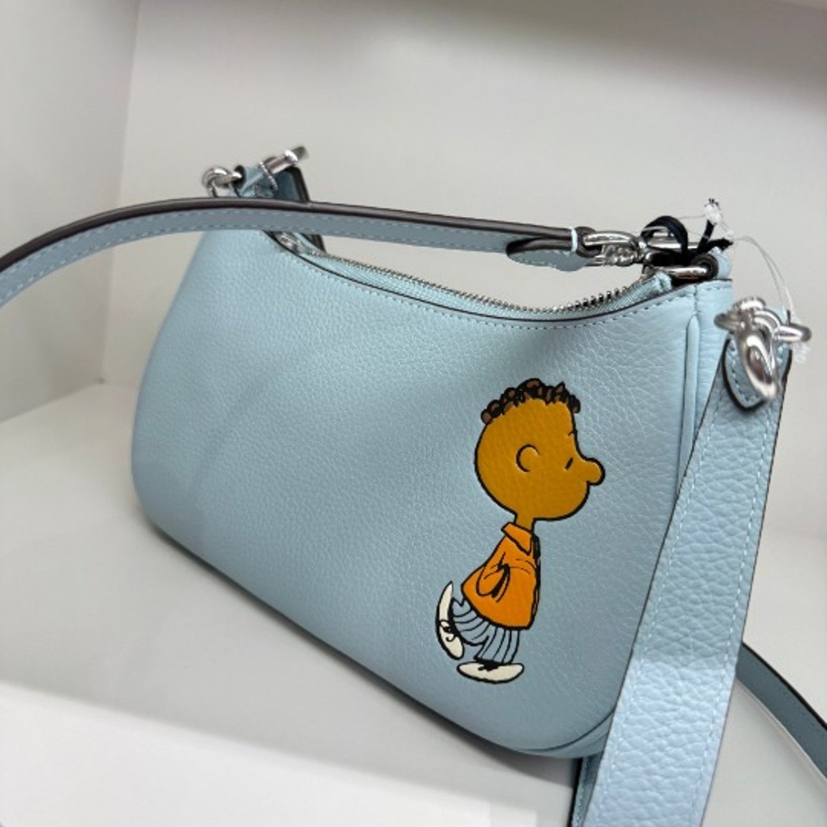 COACH X PEANUTS】斜め掛け ボディバッグ スヌーピー