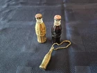 Two Vintage Coca-Cola Coke Bottle Lighters Gold and brown set. plus, keychain
