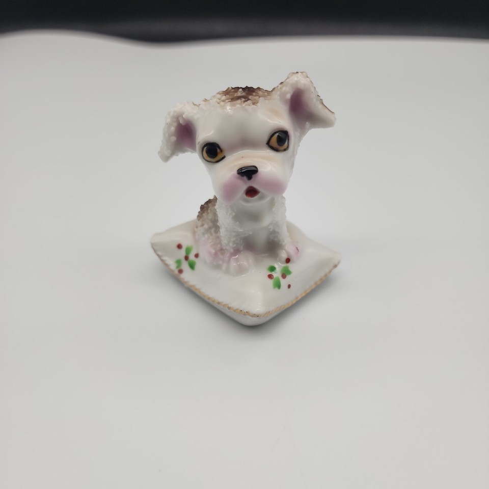 A tiny anthropomorphic dog figurine from Japan — the kind of kitschy mid-century charm that feels right at home on a shelf or as a whimsical white elephant gift.