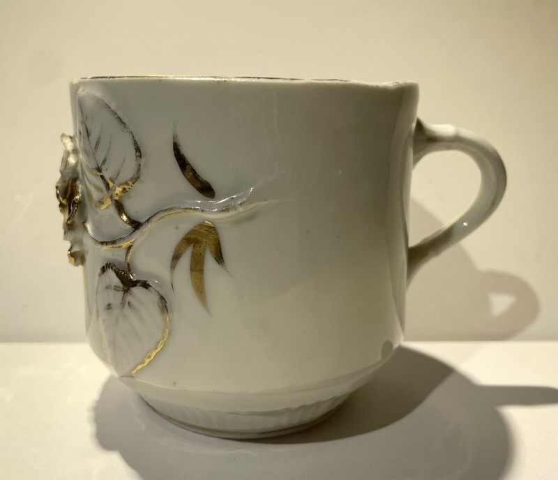 vintage early porcelain moustache cup with gold lustre glaze