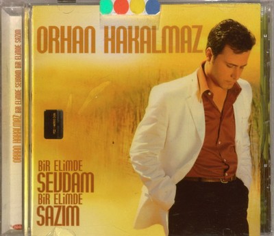 10100--Orhan Hakalmaz Bir Elimde Sevdam Bir Elimde Sazim 1.Baski,Jelatinli