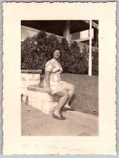 Vtg B&W Snapshot Woman Floral Dress Sitting Stone Wall Porch Deck 1940s