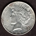 1928-D PEACE SILVER DOLLAR.  UNCIRCULATED.  TONING. YOU GRADE IT.