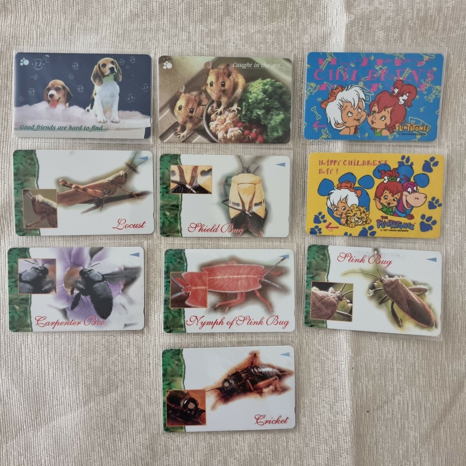 SINGAPORE PHONE CARDS Collection group of 10 animal insects The Flintstones