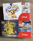 Pokemon Costco Prismatic Evolutions & Surging Sparks ETB/Booster bundle Set of 2