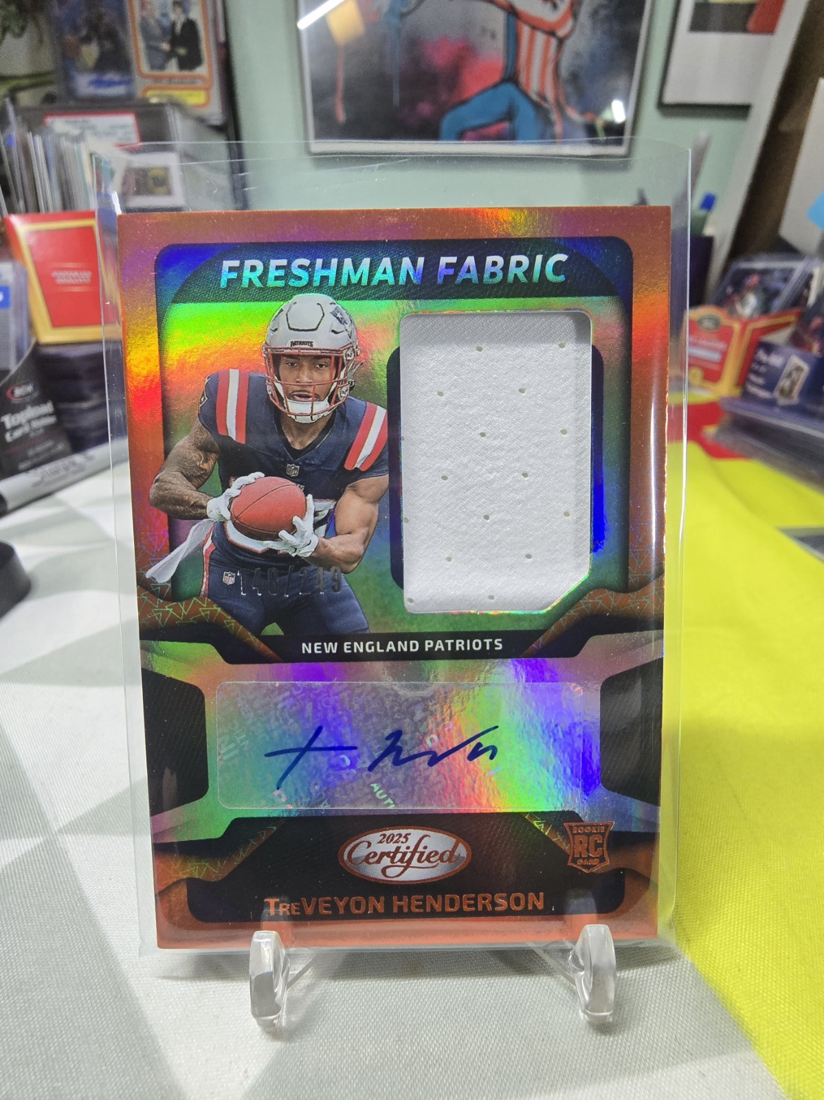 2025 Certified Freshman Fabric /249 Auto Orange Treveyon Henderson RC Patriots