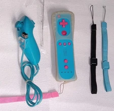 Lot: Pink & Blue Wii Remote W/ Nunchuck, Jelly Jacket & Extra Wrist Teathers