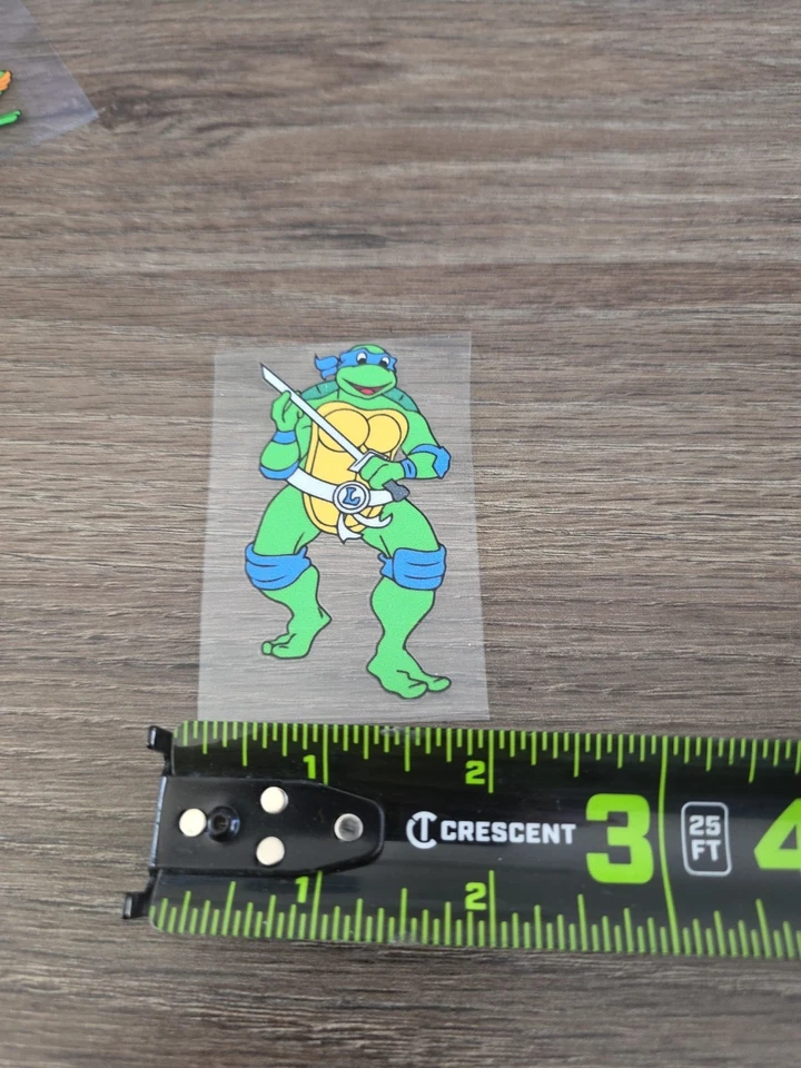 Paquete de 6 calcomanías a todo color Teenage Mutant Ninja Turtles elevadas UV DTF Foto 3 de 4