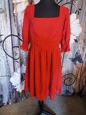 a red short-sleeved mini dress featuring a textured chevron pattern, Clearance 