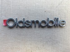 Nos Oem 1985-91 Oldsmobile Rear End Panel Emblem 20477074