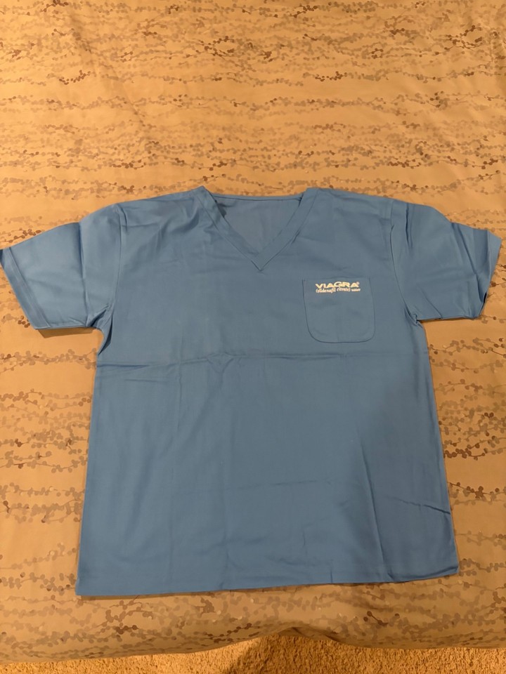 A genuine deadstock pharmaceutical promo scrub shirt from the Viagra era — a rare, wearable slice of late-90s pharma marketing history that doubles as the perfect doctor Halloween costume or gag gift.
