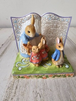 Jim shore once upon a time there were four Peter rabbit book statue as is Easter
