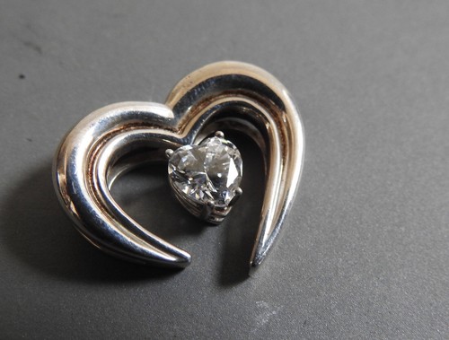 Sterling silver heart shaped pendant with heart shaped sparkly CZ