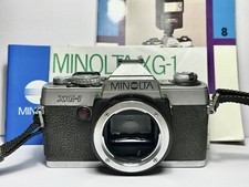 Reflex Argentique SLR Film 35mm MINOLTA XG-1 MF + BOUCHON/SANGLE/NOTICE/LIVRE