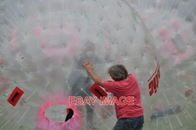 PHOTO  WESTON SUPER  MARE ZORBING ON THE GREEN IT LOOKS AS THOUGH THIS MAN IS AB