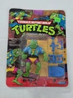 S-404 VINTAGE 1980'S TEENAGE MUTANT NINJA TURTLES GENGHIS FROG MINT ON CARD