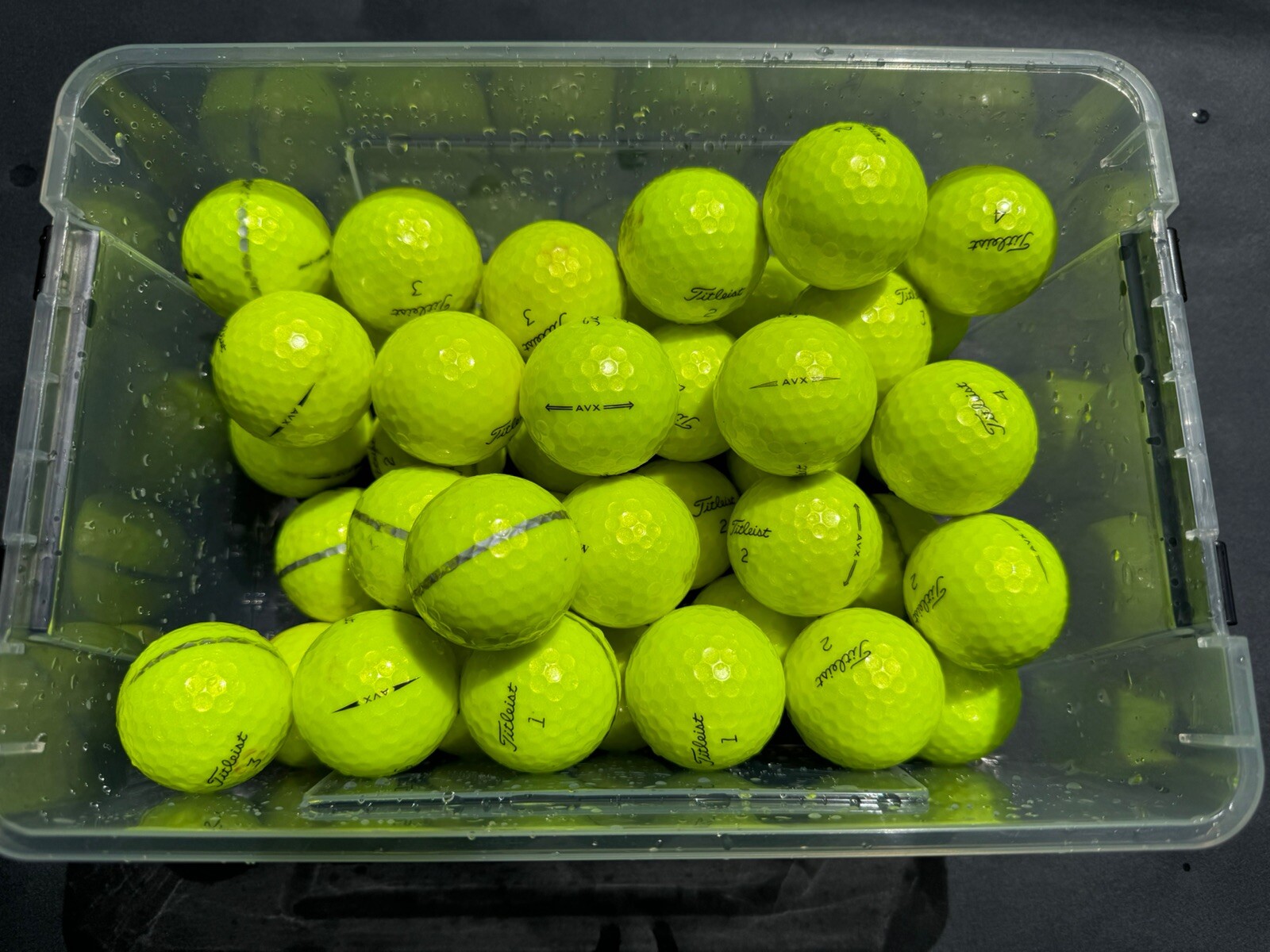 42 Titleist AVX yellow golf balls in great condition. Most Are Grade