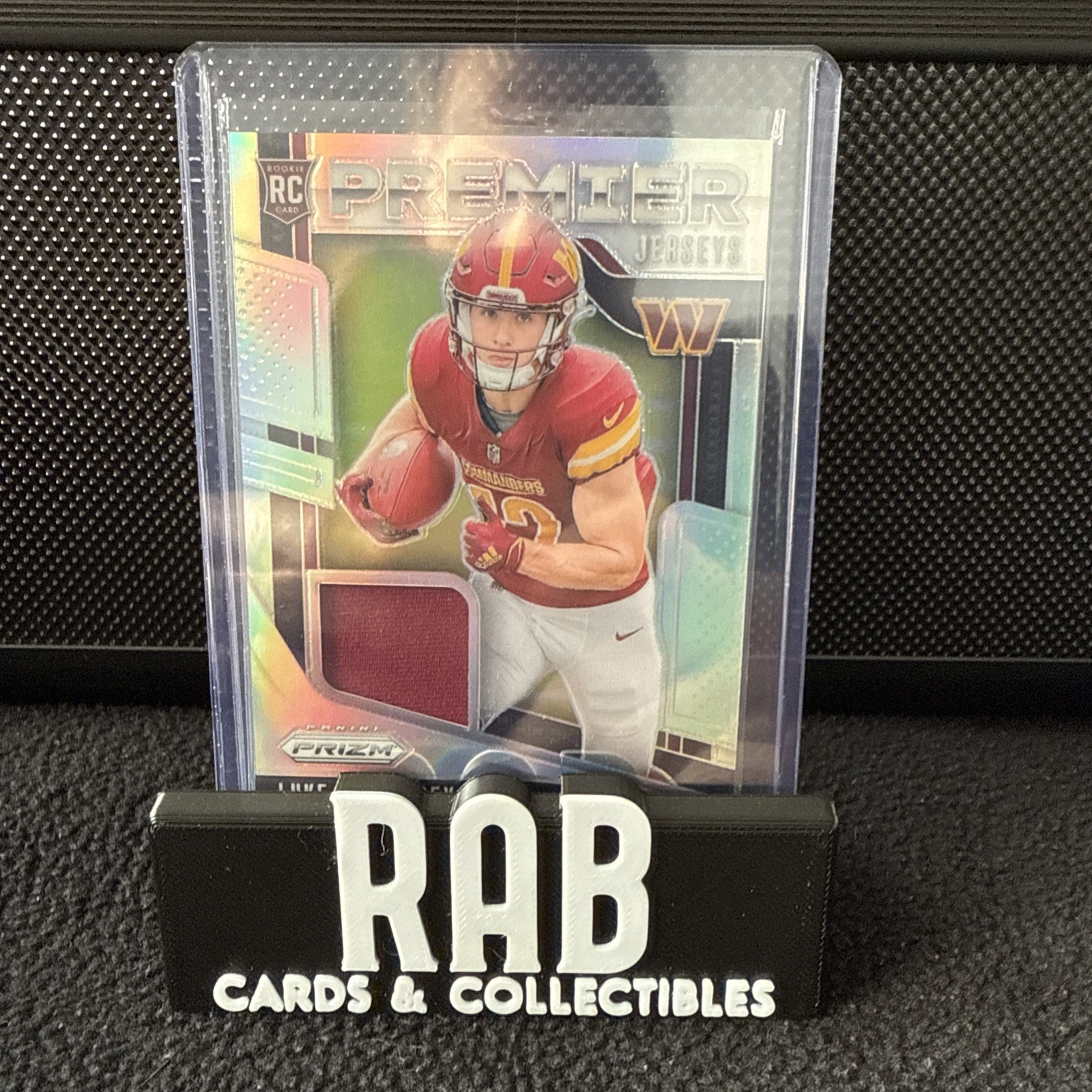 2024 Panini Prizm - Premier Jerseys Luke McCaffrey #PJ-LMY (MEM, RC)