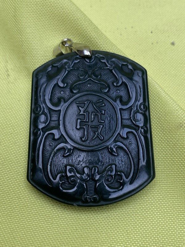 carved black jade Qilin pendant