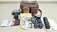 Canon AL-1 SLR Film Camera with 4 Lens, Cleaning Tool, Flash, Carry Bag & Acc.