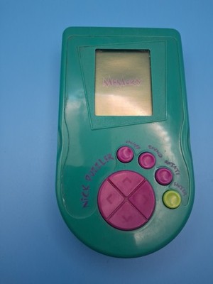 NICK PUZZLER ELECTRONIC HANDHELD TRAVEL GAME TRAVEL MEMORY PUZZLE TOY 1995