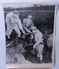 WWII Helmet Brigade Bails out Gun Emplacement Official Archive Photo 1943