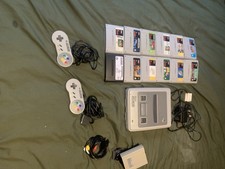 Super Nintendo SNES Console Bundle With 11 games one test cartridge and two pads