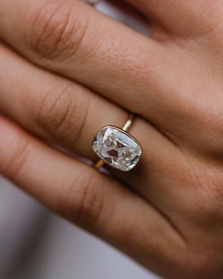 3.40 Carat Old Mine Elongated Cushion Cut Moissanite Bezel Set Engagement Ring.