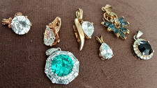 Lot of 7 crystal pendants, 4 clear, one emerald, 1 blue, 1 black, mix metals