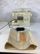 Singer 4522C electric sewing machine with cover  and original instructions