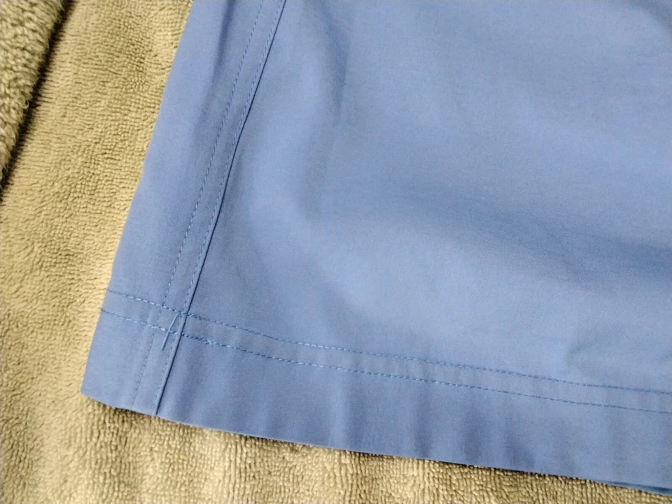 Falda corta de golf Tail Tech para mujer talla 4 azul cielo bolsillos con cremallera botón a presión Foto 4 de 4